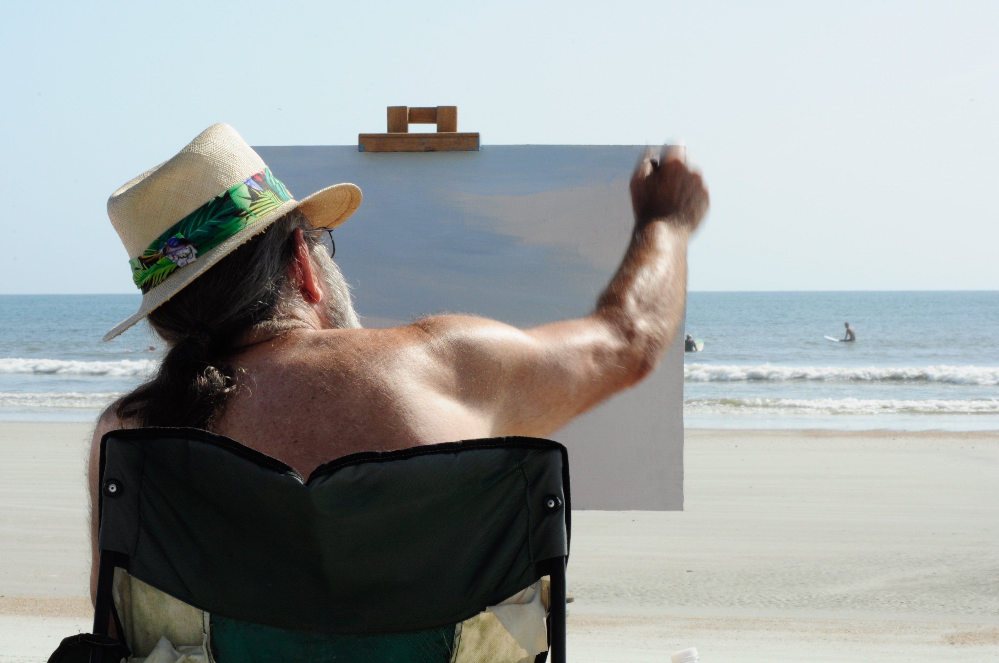 Artist James A. Lacey painting on the beach at Huguenot Park